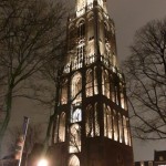 A church lit up on a stormy night